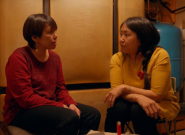 Two women from the film Tautuktavuk sit together in deep conversation