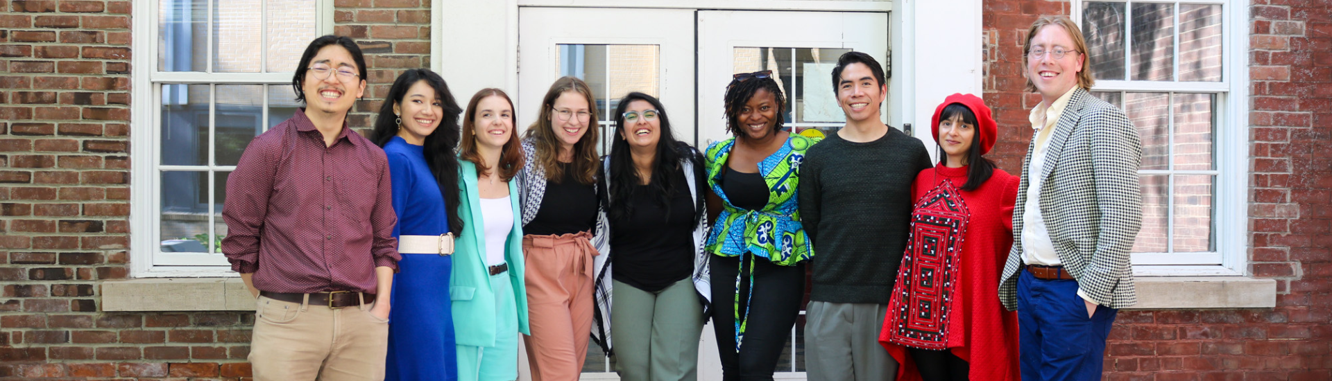 MA students standing outside the Playhouse Theatre: Sungwon Cho, Prashanthi Pothmitiyage Don Perera, Emma Pressello, Bethany Schaufler-Biback, Malika Daya, Sheila Ayine, Raymundo Moreno Reyes, Aylin Salahshoor, Professor Douglas Eacho